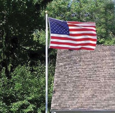 American flag flying near house