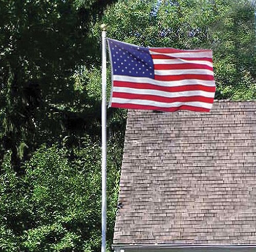 American flag flying near house