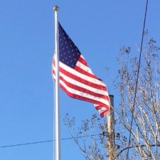 American flag on a pole sky backgro