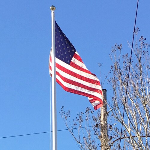 American flag on a pole sky backgro