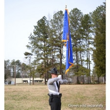 flag bearer in uniform outdoors