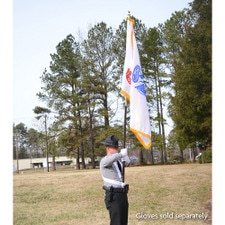 man in uniform holding a flag