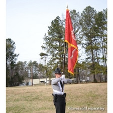Officer holding a flag outdoors
