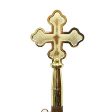 golden cross on a wooden stick