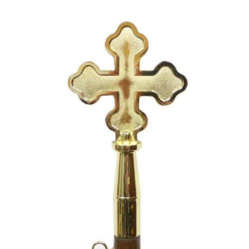 golden cross on a wooden stick