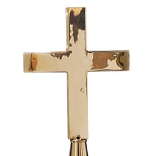 gold cross on display stand