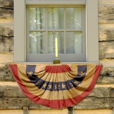 red white blue bunting at a window