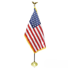 US flag on pole with eagle top