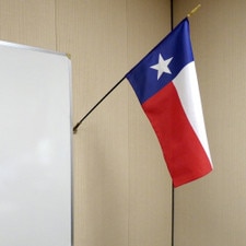 Texas flag hanging on wall indoors
