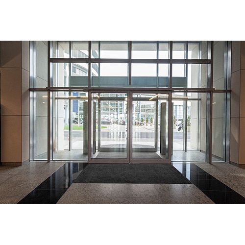 glass entrance with revolving doors