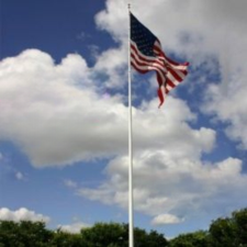 American flag against cloudy sky