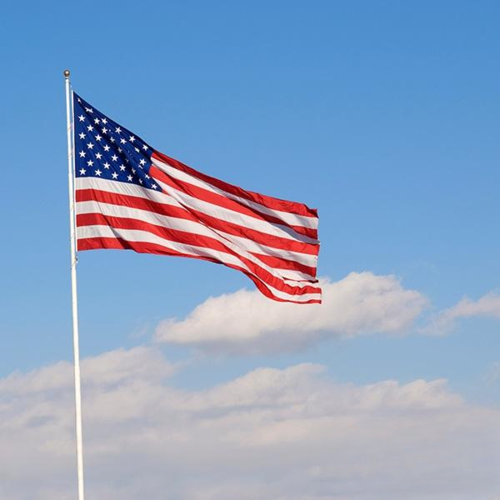 American flag waving in sky
