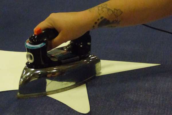 Star being ironed onto flag